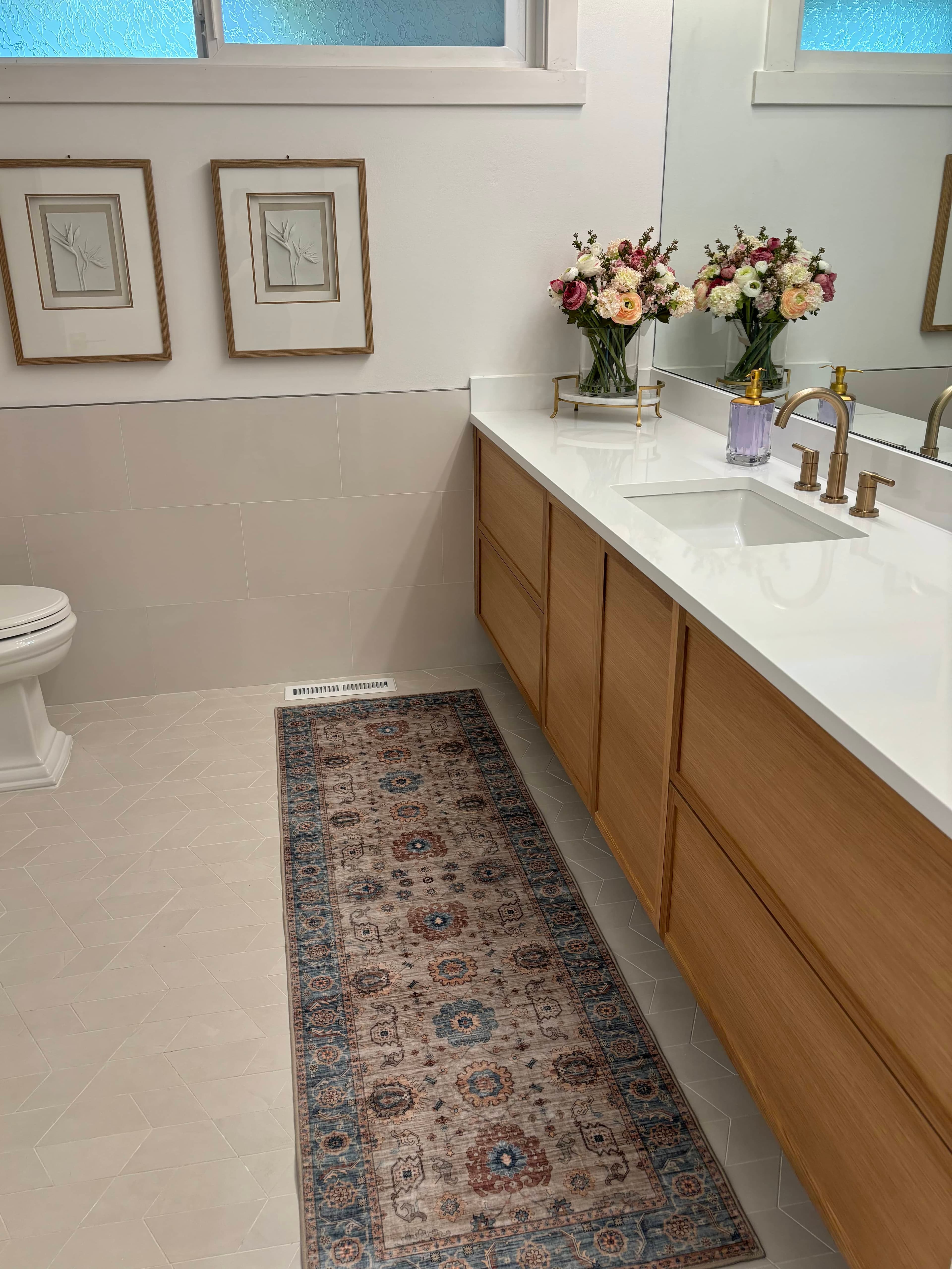 Bathroom view showing accessible fixtures and warm lighting.