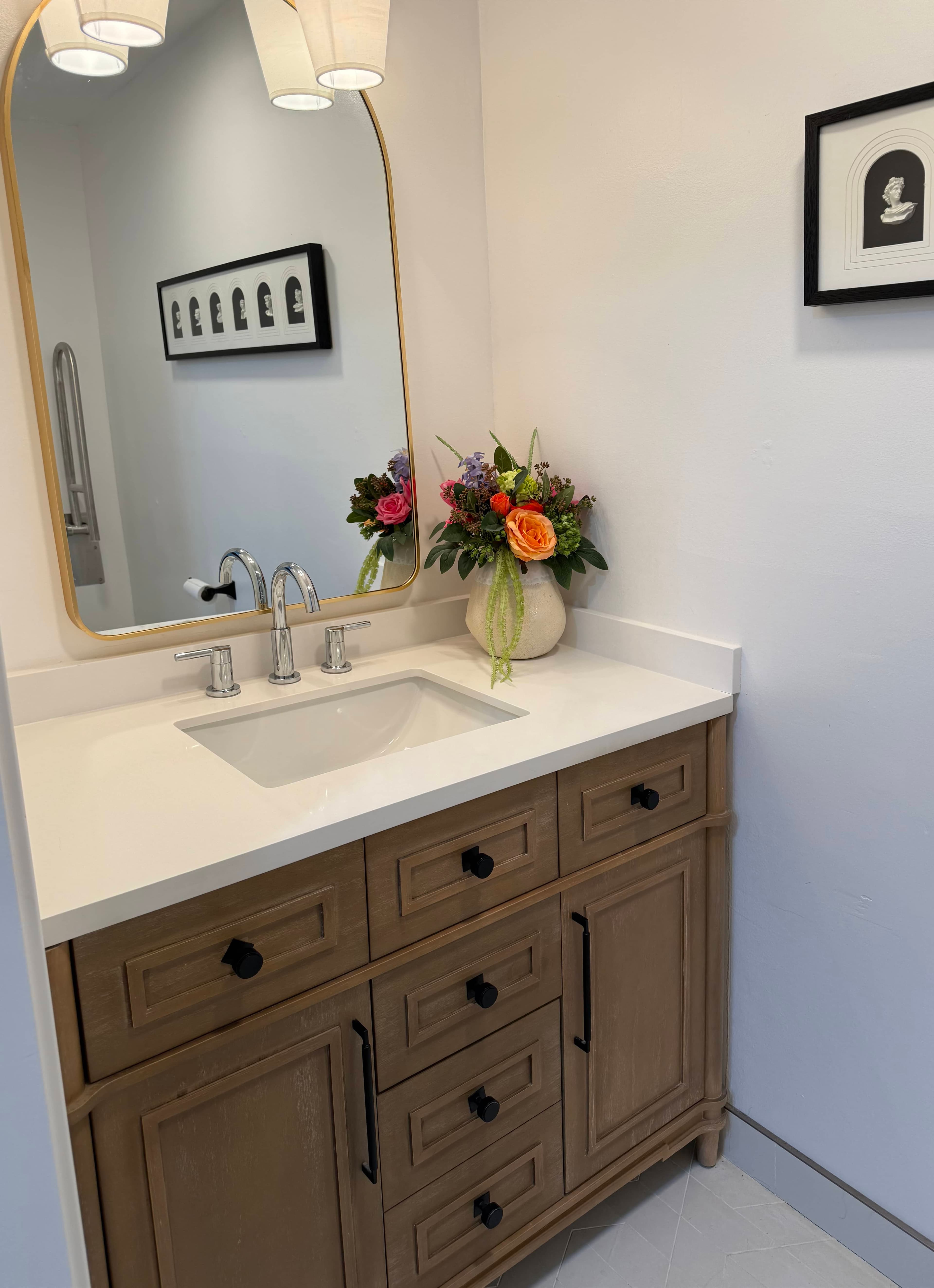 Bathroom with walk-in shower, comfort-height toilet, and grab bars.