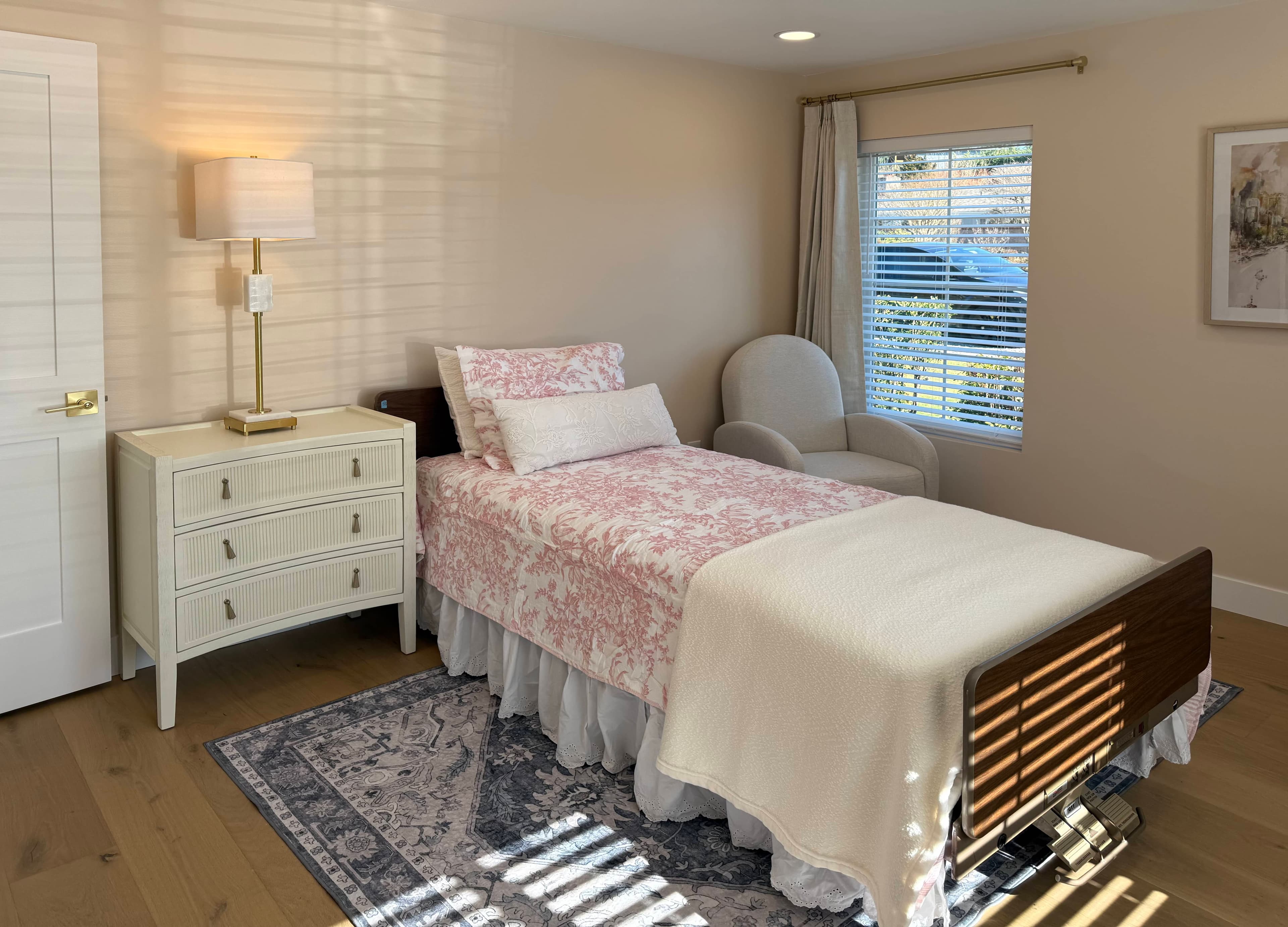 Bedroom with crisp white linens and soft daylight from the window.
