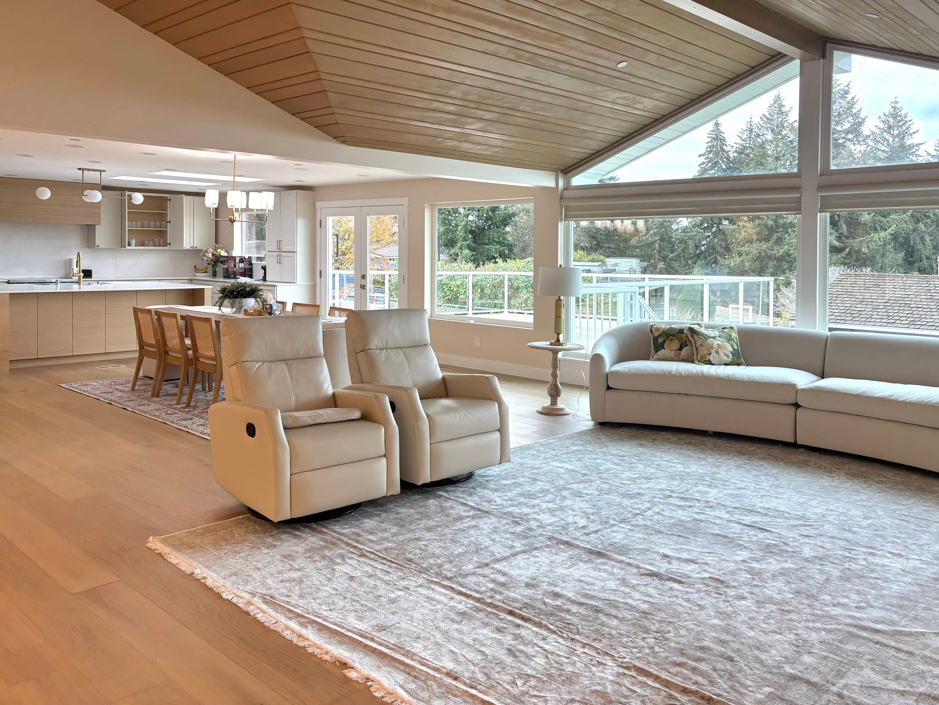 Transition between the living room and kitchen, showing wood floors and natural light.