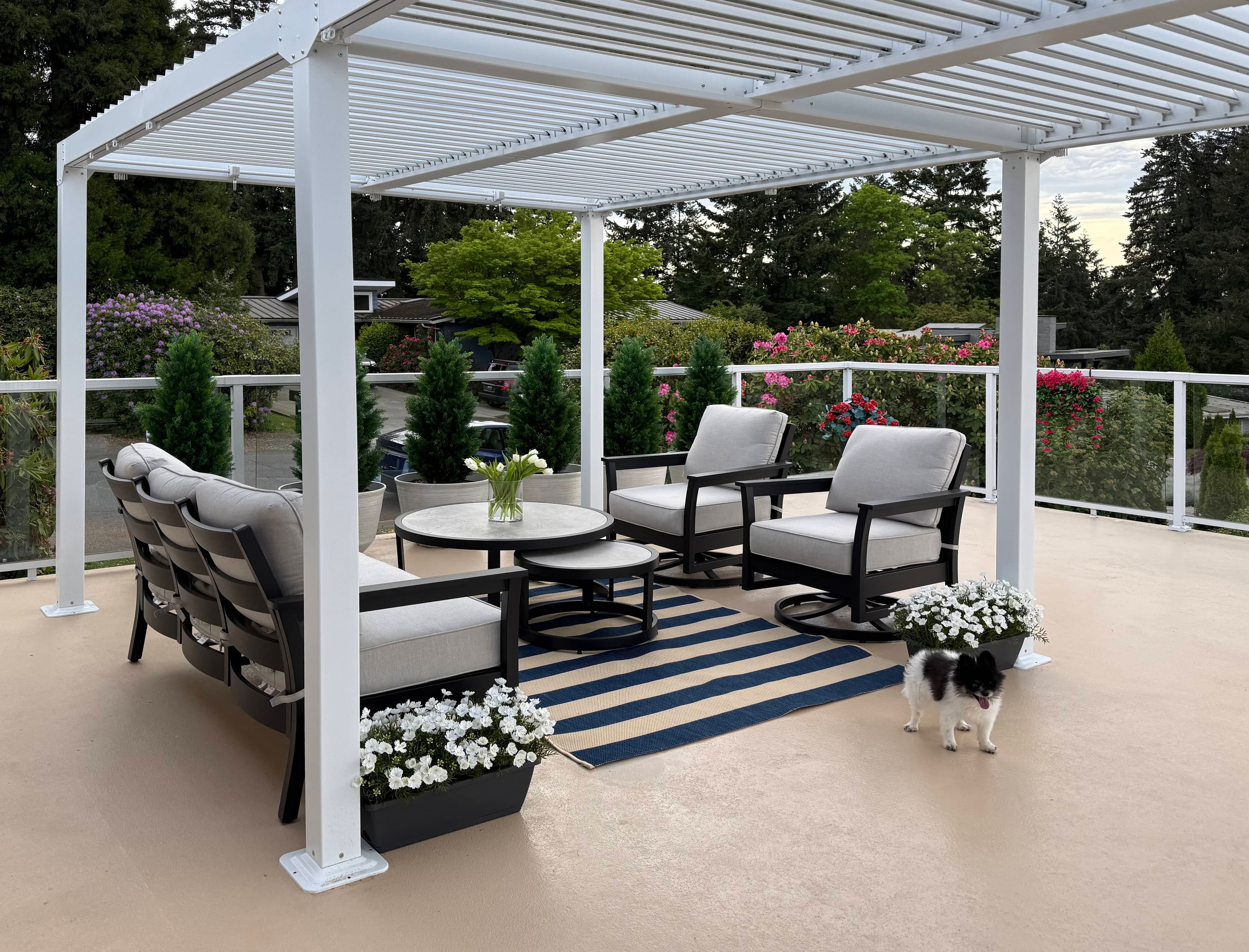 Covered front porch with seating overlooking the neighborhood.