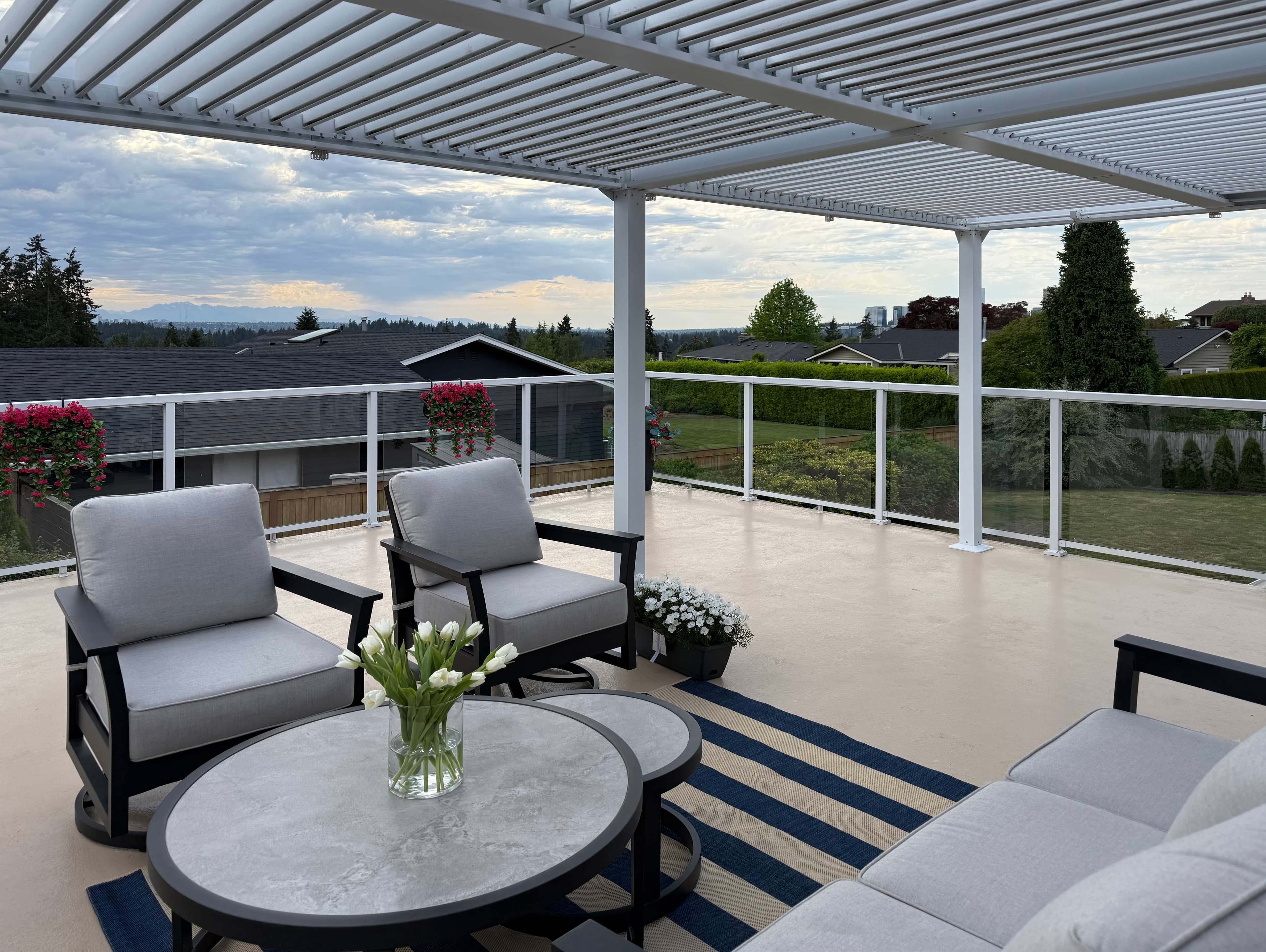 Second porch view, showing the railing and a quiet outdoor sitting area.